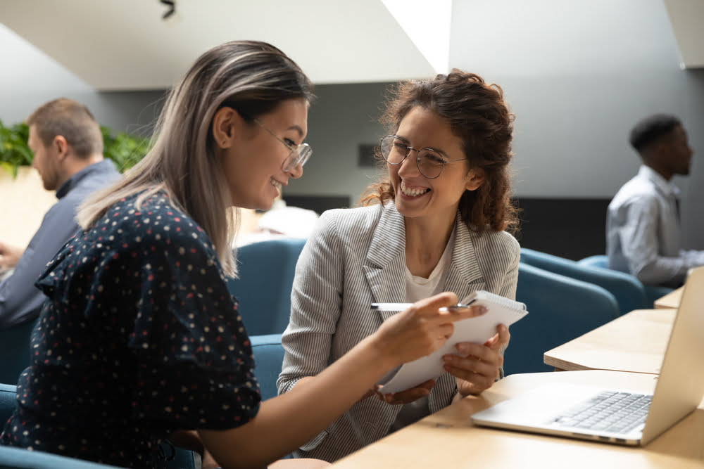 Co-workers working wearing eye glasses - Neurolens in Buena Park, CA Co-workers working wearing eye glasses - Neurolens in Buena Park, CA
